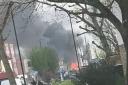 Fire destroyed a caravan and damaged hoardings and part of a bus shelter in Enfield