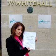 The people speak: Lynne Featherstone MP is handing more than 200 personal accounts of the Whittington Hospital, in Archway, to health minister Mike O'Brien