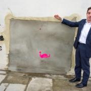 Cllr Alan Strickland at the Whymark Avenue wall from which the Bansky was taken