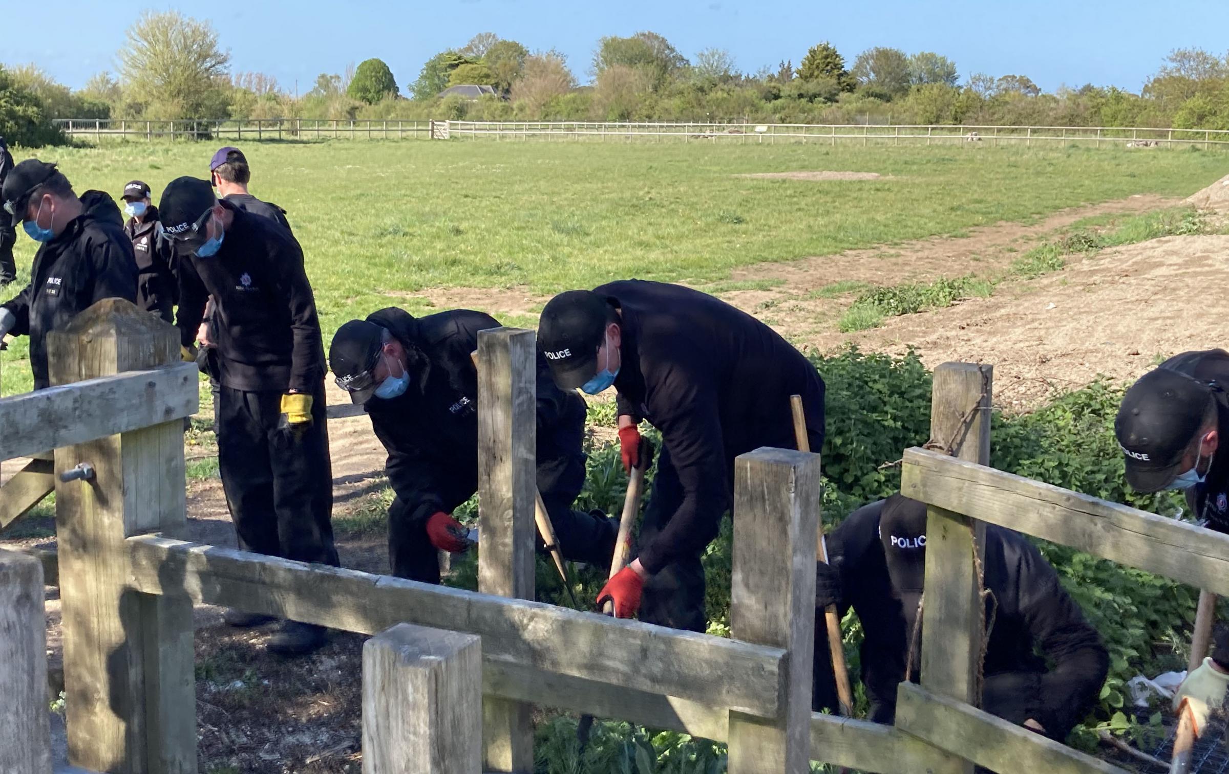 Police officers searching a field off Ratling Road in Aylesham, Kent. Michael Drummond/PA Wire