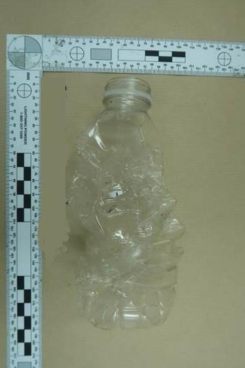 The bottle found in the exhaust pipe of a diplomatic vehicle near the Iranian embassy. Credit: Met Police
