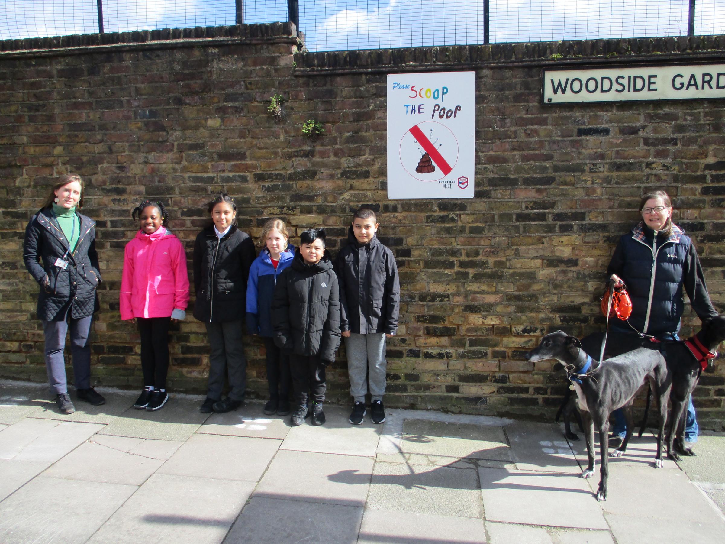 Some of the children involved in creating the posters, their teacher Catherine Butler, and the co-ordinator of the Beautiful Bruce Grove group, Catherine Suttle 