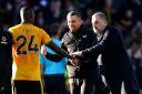 Tottenham boss Ange Postecoglou shakes hands with Wolves Toti Gomes
