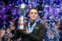 Ronnie O’Sullivan celebrates with the trophy after winning a record-extending eighth UK Championship (Mike Egerton/PA)