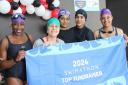 Swimmers celebrate completing the challenge