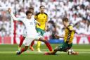 Dele Alli goes into a challenge in England's World Cup qualifying win over Lithuania on Sunday. Picture: Action Images