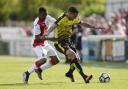 Jose Holebas fends off a challenge at Woking last pre-season. Picture: Action Images