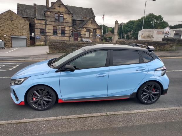 Tottenham Independent: The Hyundai i20 N on test in the Low Moor area of Bradford, and pictured (top left) next to the flywheel on New Works Road once used in the Low Moor Steel Works