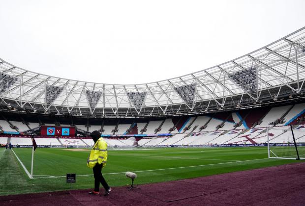 Tottenham Independent: A general view of a steward by the pitch before the Premier League match at the London Stadium, London