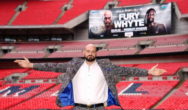 Tottenham Independent: Tyson Fury poses on the pitch after the press conference at Wembley Stadium, London (PA)