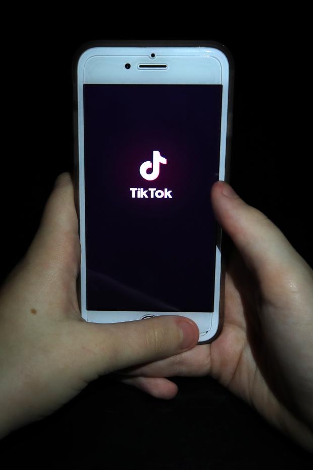 Tottenham Independent: A person with TikTok open on their phone. Credit: PA