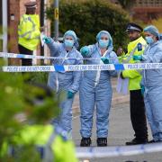 Forensic investigators in Laing Close in Hainault, north east London, after a 14-year-old boy died after being stabbed and a sword-wielding man arrested (Jordan Pettitt/PA)